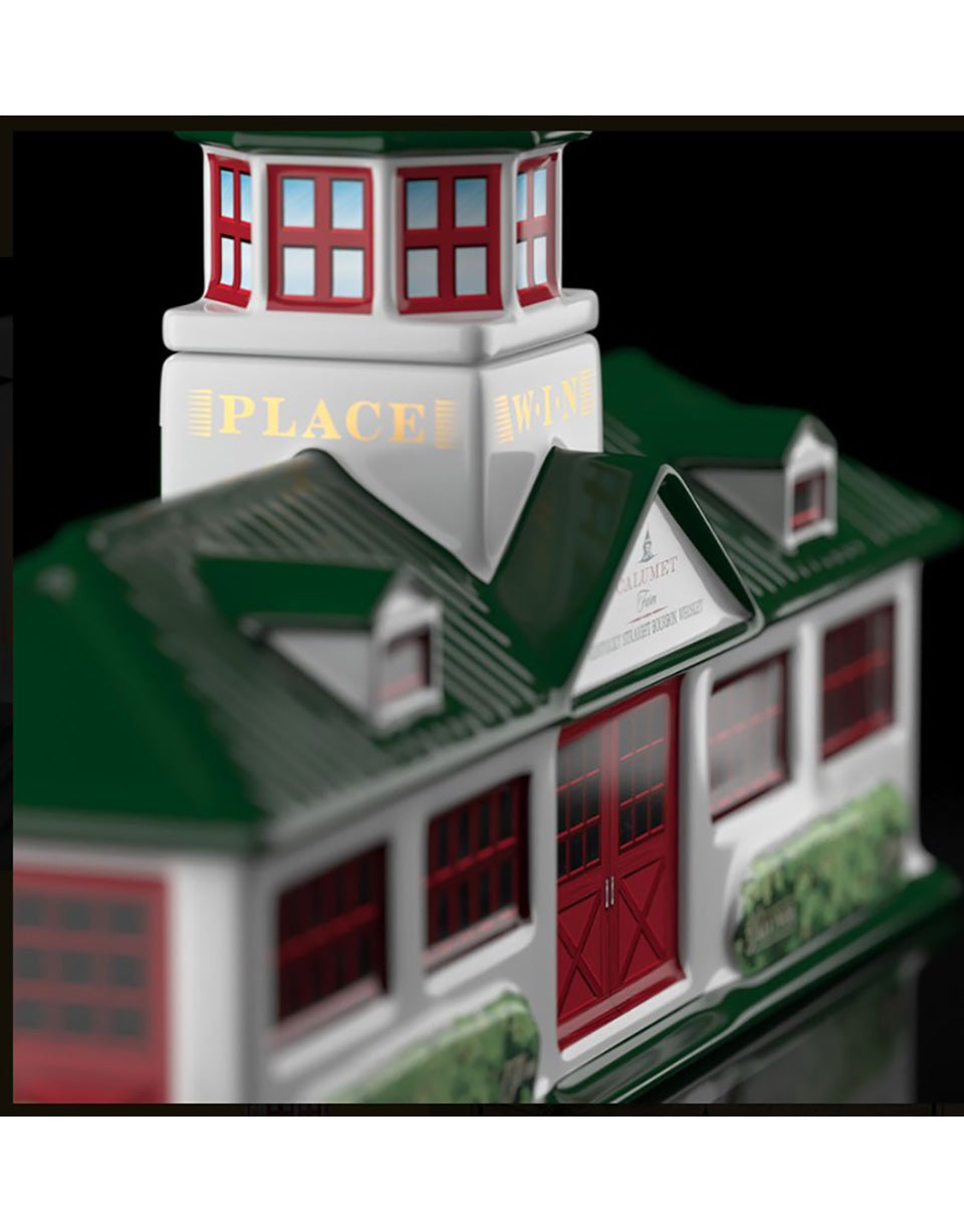 Model of a building with green roof and red doors, featuring 'PLACE' text.