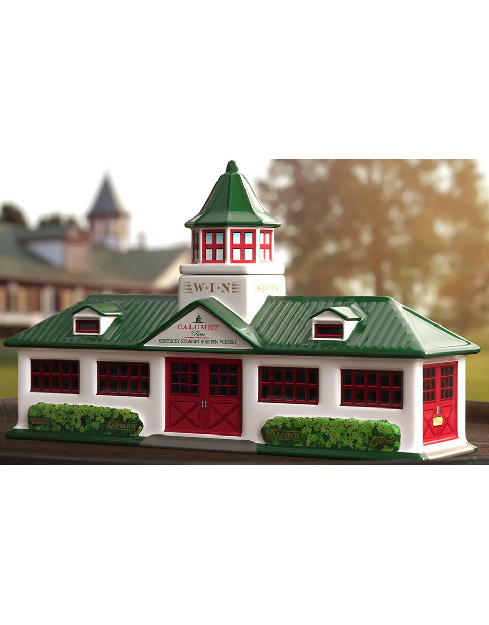 Model of a building with green roof and red doors on a white background
