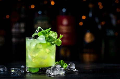 Bright green Gin Basil Smash with fresh basil