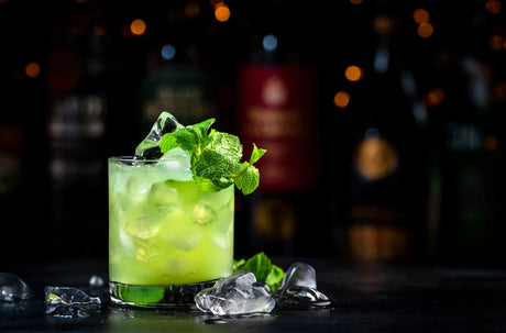 Bright green Gin Basil Smash with fresh basil