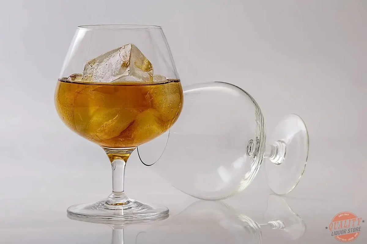 Brandy in a tulip glass with fruit and oak