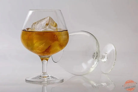 Brandy in a tulip glass with fruit and oak