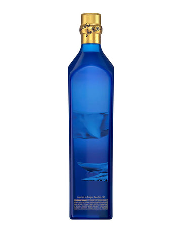 Blue bottle with gold cap on a white background
