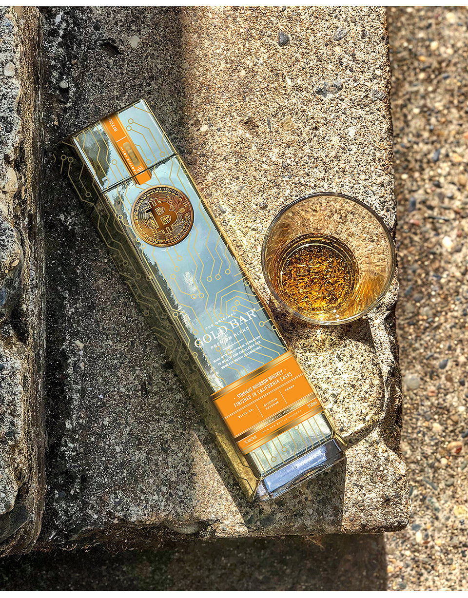 Gorilla Glue packaging with a glass of amber liquid on a textured surface