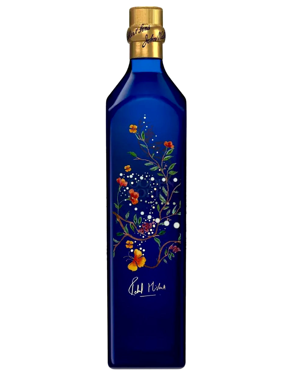 Blue bottle with floral design and gold cap on a white background